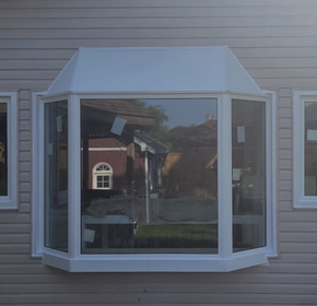New build bay window with aluminum roof and skirt